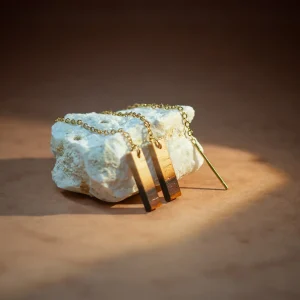 Boucles d'oreille en chutes de bois précieux chaînettes barre · doré